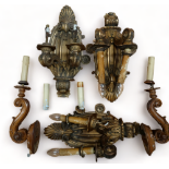 Three early 20th century German carved giltwood wall brackets - with foliage and scroll arms, height