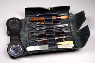 A leather wallet of surgical instruments - by S. Mawson & Thompson, together with an ophthalmic