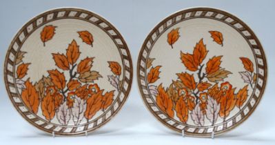 A pair of Crown Ducal chargers by Charlotte Rhead - autumn leaves, 32cm diameter, facsimile