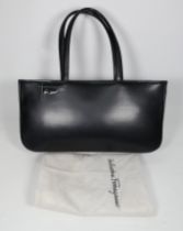 A Salvatore Ferragamo black leather handbag - width 42cm, height 21, with original branded dustbag.