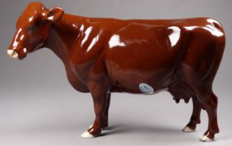 A Beswick Red Poll cow - model number 4111, designed by Robert Donaldson, 16cm high