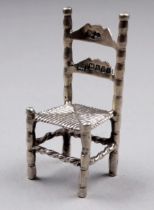 A Victorian silver miniature chair - London 1897, Louis Landsberg, height 5cm, weight 14.1g.