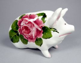 A Wemyss ware pottery money box pig - decorated with cabbage roses, 17cm wide