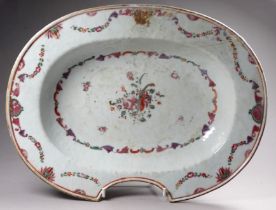 A late 18th century barber's bowl - oval and decorated with swags and sprigs of roses, width 32cm.
