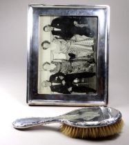 A silver photograph frame - Birmingham 1916, Walker & Hall, 25 x 20cm, together with a silver backed