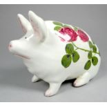 A Wemyss ware pottery pig - decorated with clover flowers, 17cm wide