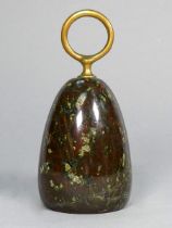 A serpentine doorstop - with brass ring handle, height 16cm.