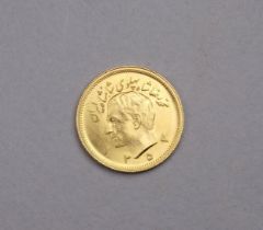 A one Pahlavi 22ct gold coin - obverse with bust of Mohammed Reza, the reverse with a lion holding a