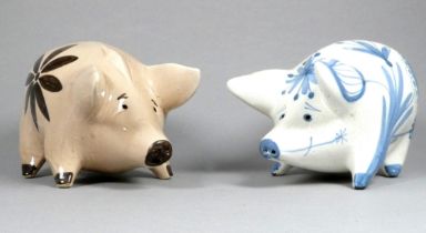 A Rye Pottery pig - by David Sharp, decorated with blue foliage and flowers, 19cm wide, together