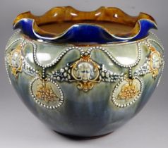 A Lambeth Royal Doulton jardiniere - decorated in blue/green glazes incorporating a frilled rim