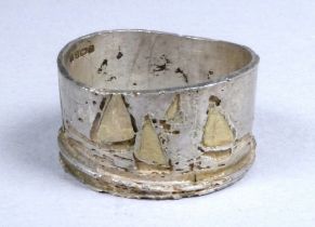 A silver ring, Birmingham, Jennie Hancox of Zennor, engraved with a continuous design of siling
