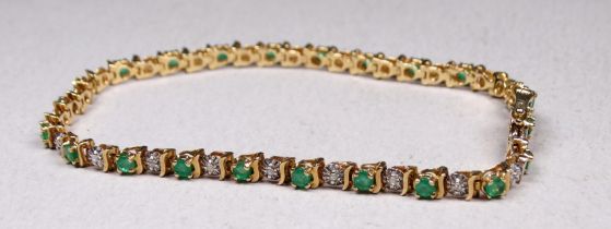 A 9ct gold emerald and diamond line bracelet - 18cm long, 6g