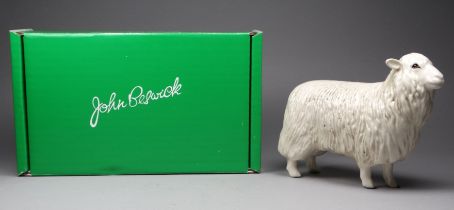 A Beswick Cotswold ewe - model no. 4122, 12cm high, boxed.