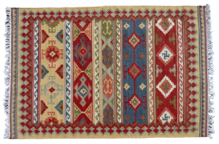A 20th century Kelim rug - multi coloured with a geometric design within a serrated sand coloured
