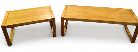 A contemporary Danish teak coffee table - the rectangular top on open square end supports, width