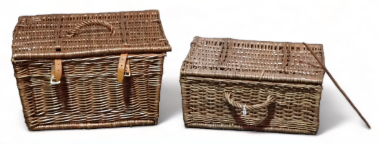 A wicker picnic basket - the lid with a hoop handle and tan leather straps, width 43cm, together