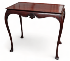 A George II style mahogany silver table - the rectangular tray top on cabriole legs and shaped apron