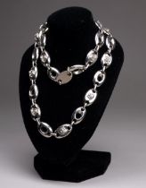 A Gianni Versace necklace - the white metal oval links interspersed with trade mark Medusa heads,