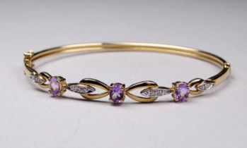 A 9ct yellow gold amethyst and diamond set bracelet - weight 5.7g.