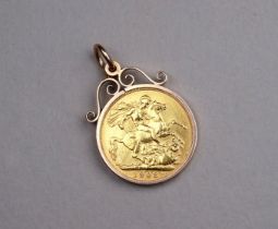 An Edward VII sovereign - in a 9ct gold mount, 9.9g