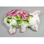 A Wemyss Exon recumbent pottery pig - decorated with cabbage roses by B Adams, impressed and painted