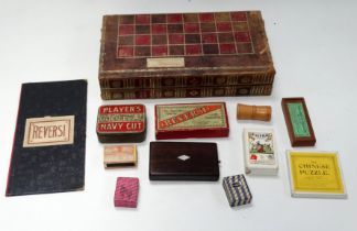 A 19th/20th century leather games board - modelled in the form of a pair of books, the exterior with