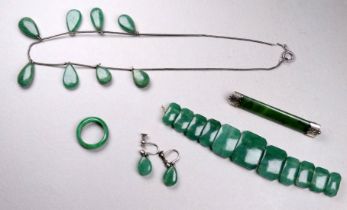 A jade bar brooch with white metal mounts - together with a small quantity of jade and faux jade