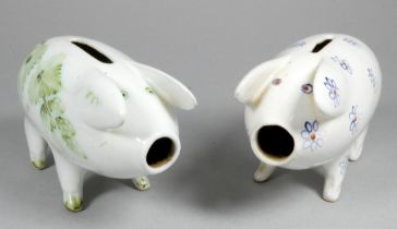A Rye Pottery piggy bank - decorated with blue flowers, 14cm wide, together with another similar