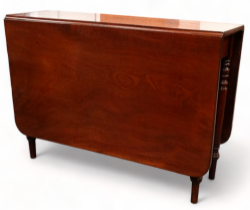 A 19th century mahogany drop leaf table - the rectangular top above a gateleg action on turned