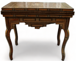An early 20th century Middle Eastern Damascus games table - with typical intricate marquetry inlay