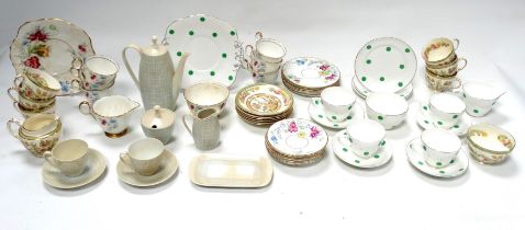 A Delphine bone china tea service - Dawn pattern, six place settings with a sandwich plate,