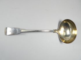 A silver ladle - London 1816, indistinct maker's mark, fiddle back and engraved with initials,