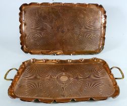 An early 20th century rectangular copper tray - with twin brass handles and decorated with a sun-