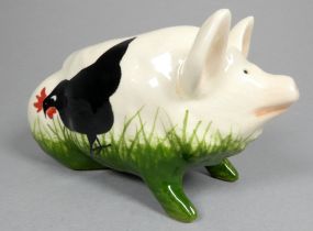 Wemyss Griselda Hill pottery pig - seated, decorated with black chickens, 18cm wide