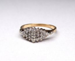 A 9ct gold diamond set dress ring - of stepped navette form, with twenty six stones, weight 2.7g.