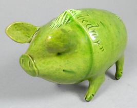 An early 20th century Rye 'Sussex Pig' - green-glazed with detachable head, incised legend 'Wunt