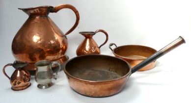 A 19th century copper 4 gallon harvest jug - together with a frying pan with conical copper