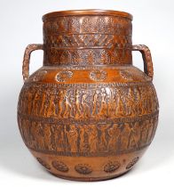 A terracotta twin handled vase - decorated with classical motif and figures, height 24cm.