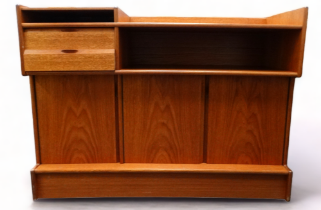 A Turnidge of London teak sideboard - of asymmetrical form, including cubby holes, drawers and