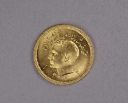 A one Pahlavi 22ct gold coin - obverse with bust of Mohammed Reza, the reverse with a lion holding a