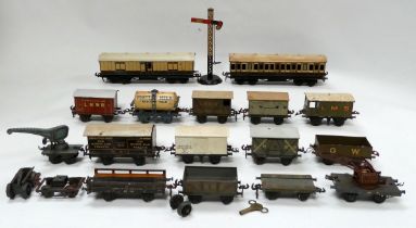 A quantity of 0 gauge rolling stock - including open wagons, carriages and guard's vehicles.