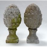 A pair of contemporary cast concrete pineapple finials - raised on a square base, height 30cm.