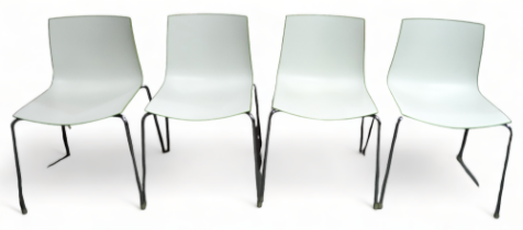 Four contemporary dining chairs by Arper of Italy - model Catifa 46, lime green and white, raised on