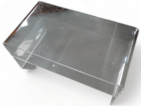 A 20th century Lucite low table - with curved ends and an undertier, width 90cm, depth 50cm,