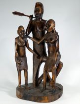 An African tribal wood carving of a Masai family group - height 45cm.