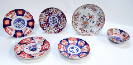 A 19th century Japanese Imari plate - fluted and with scalloped rim, decorated with flowers and