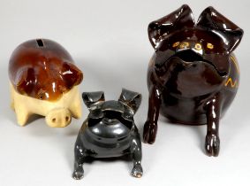 Truro Pottery treacle glazed pig - seated, signed 'Truro' and dated 1979, impressed mark to base,