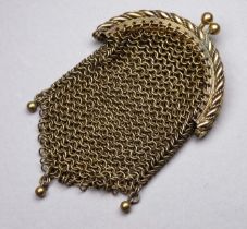 A small yellow metal chainlink purse - height 8.5cm.