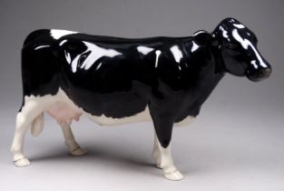 A Beswick Shetland cow - model no. 4112, 12cm high
