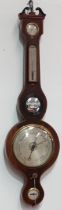 A mid 19th century mahogany cased wheel barometer - the broken swan-neck pediment above a dry/damp